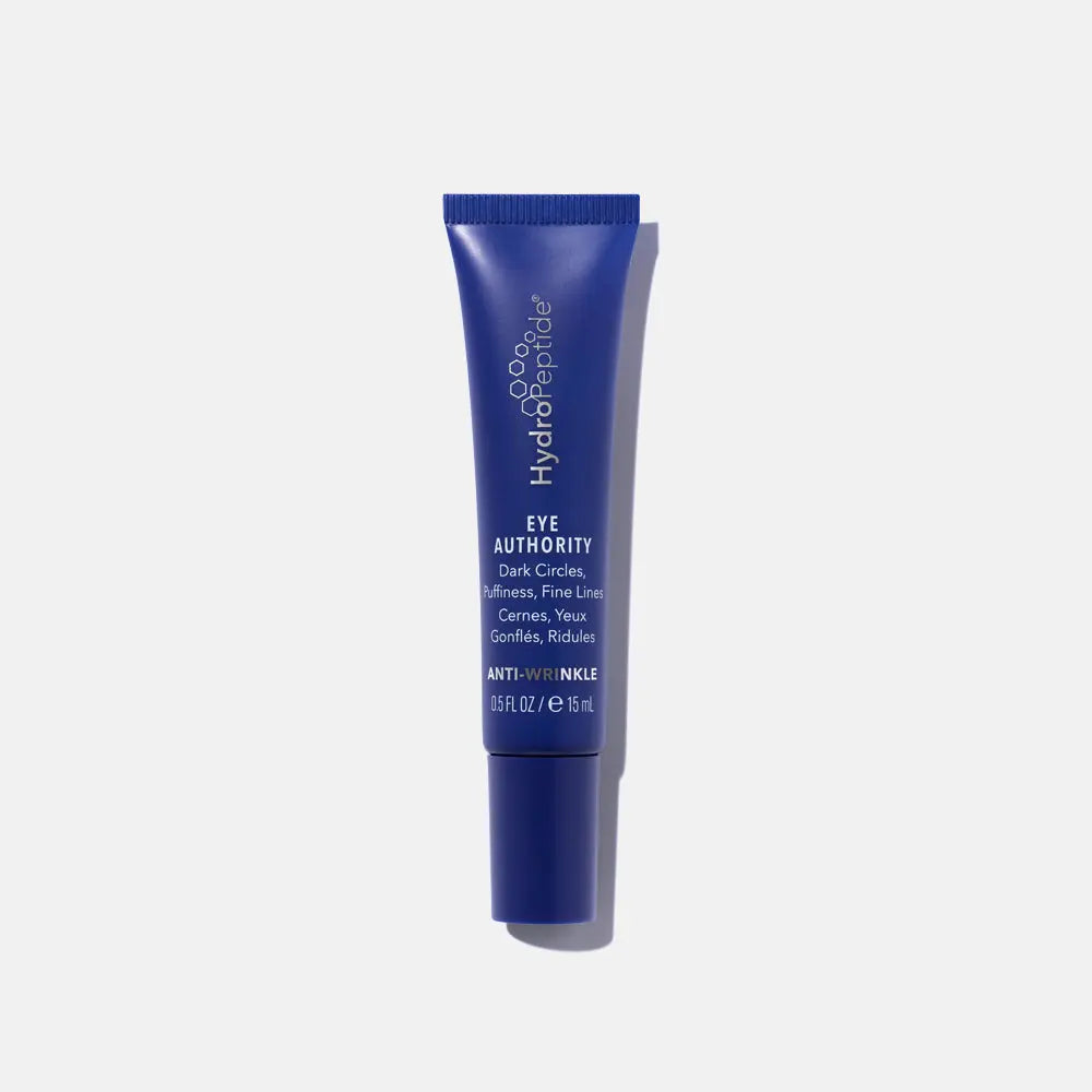 A blue tube of HydroPeptide Eye Authority eye cream , designed for brightening and reducing expression lines around the eye area.